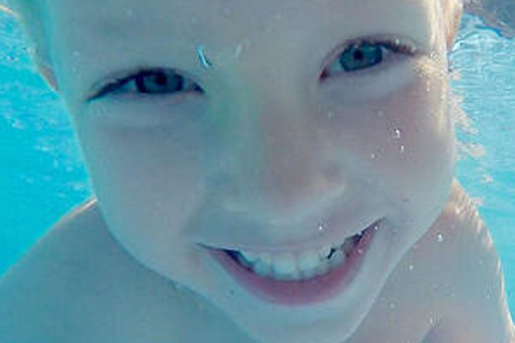 Kind having fun activities in the water